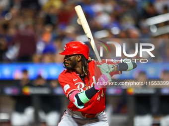 Elly De La Cruz #44 of the Cincinnati Reds hits the ground after avoiding a pitch during the ninth inning of the baseball game against the N...