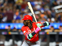 Elly De La Cruz #44 of the Cincinnati Reds hits the ground after avoiding a pitch during the ninth inning of the baseball game against the N...