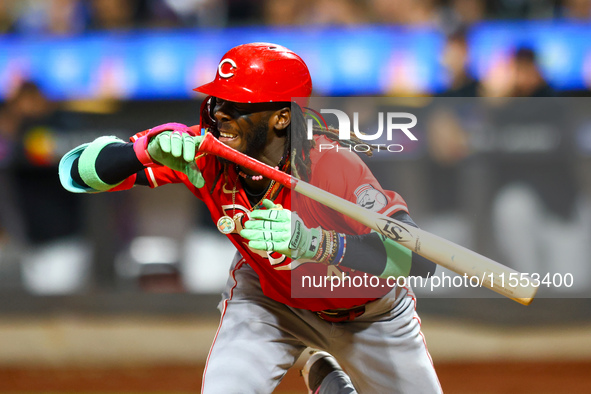 Elly De La Cruz #44 of the Cincinnati Reds hits the ground after avoiding a pitch during the ninth inning of the baseball game against the N...