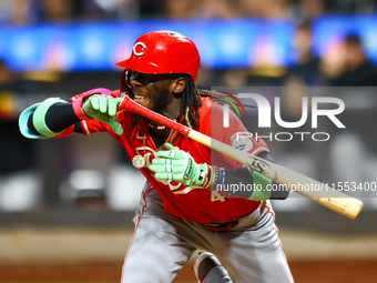 Elly De La Cruz #44 of the Cincinnati Reds hits the ground after avoiding a pitch during the ninth inning of the baseball game against the N...