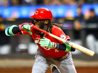 Elly De La Cruz #44 of the Cincinnati Reds hits the ground after avoiding a pitch during the ninth inning of the baseball game against the N...