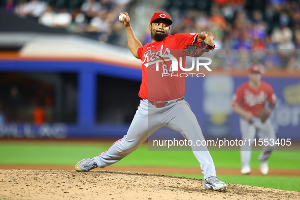 Cincinnati Reds pitcher Tony Santillan #64 throws during the eighth inning of the baseball game against the New York Mets at Citi Field in C...