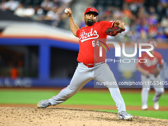 Cincinnati Reds pitcher Tony Santillan #64 throws during the eighth inning of the baseball game against the New York Mets at Citi Field in C...