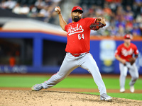 Cincinnati Reds pitcher Tony Santillan #64 throws during the eighth inning of the baseball game against the New York Mets at Citi Field in C...