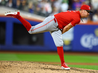 Cincinnati Reds pitcher Emilio Pagan #15 throws during the seventh inning of the baseball game against the New York Mets at Citi Field in Co...