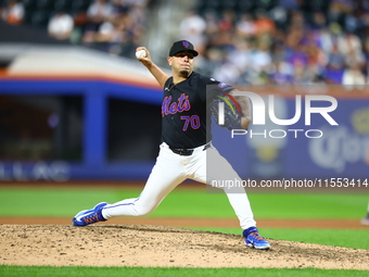 New York Mets relief pitcher Jose Butto #70 throws during the tenth inning of the baseball game against the Cincinnati Reds at Citi Field in...