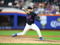 New York Mets relief pitcher Jose Butto #70 throws during the tenth inning of the baseball game against the Cincinnati Reds at Citi Field in...