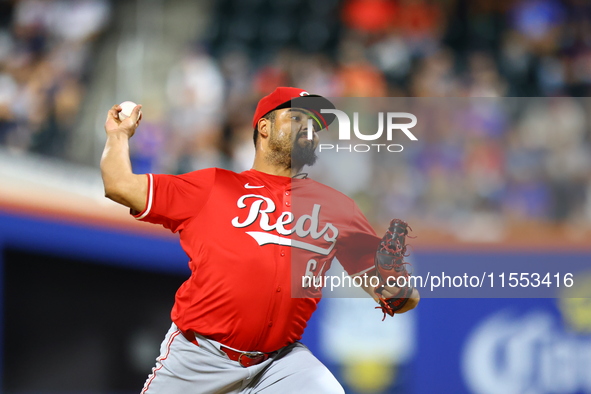 Cincinnati Reds pitcher Tony Santillan #64 throws during the eighth inning of the baseball game against the New York Mets at Citi Field in C...