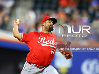 Cincinnati Reds pitcher Tony Santillan #64 throws during the eighth inning of the baseball game against the New York Mets at Citi Field in C...