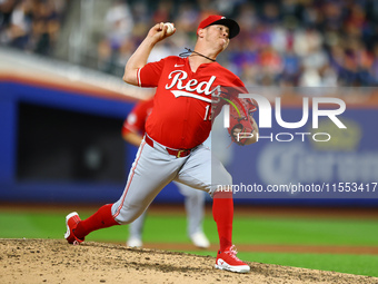 Cincinnati Reds pitcher Emilio Pagan #15 throws during the seventh inning of the baseball game against the New York Mets at Citi Field in Co...