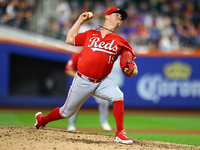 Cincinnati Reds pitcher Emilio Pagan #15 throws during the seventh inning of the baseball game against the New York Mets at Citi Field in Co...