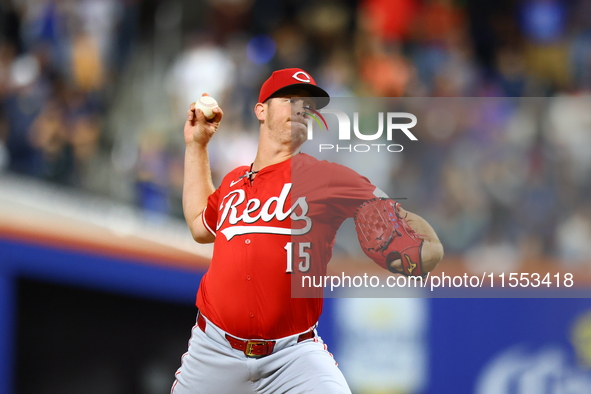 Cincinnati Reds pitcher Emilio Pagan #15 throws during the seventh inning of the baseball game against the New York Mets at Citi Field in Co...