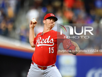 Cincinnati Reds pitcher Emilio Pagan #15 throws during the seventh inning of the baseball game against the New York Mets at Citi Field in Co...