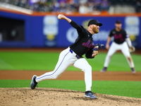 New York Mets relief pitcher Reed Garrett #75 throws during the seventh inning of the baseball game against the Cincinnati Reds at Citi Fiel...