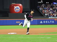 Mark Vientos #27 of the New York Mets rounds the bases after a 10th inning game-winning home run to give the Mets a 6-4 victory in the baseb...