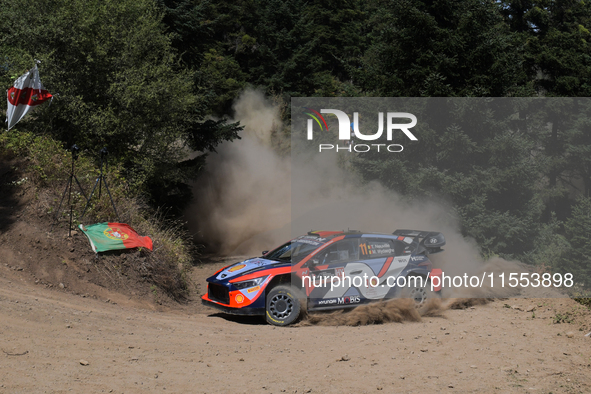 Driver Thierry Neuville and co-driver Martijn Wydaeghe of the Hyundai Shell Mobis World Rally Team, in a Hyundai i20 N Rally1 Hybrid, face t...