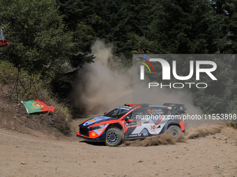 Driver Thierry Neuville and co-driver Martijn Wydaeghe of the Hyundai Shell Mobis World Rally Team, in a Hyundai i20 N Rally1 Hybrid, face t...