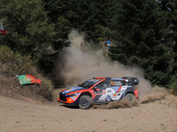 Driver Thierry Neuville and co-driver Martijn Wydaeghe of the Hyundai Shell Mobis World Rally Team, in a Hyundai i20 N Rally1 Hybrid, face t...