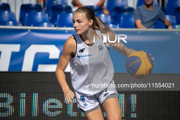 Aleksandra Kuczynska participates in the LOTTO 3x3 League basketball game in Sosnowiec, Poland, on September 6, 2024. The Lotto 3x3 Liga tou...