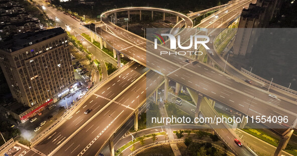 Vehicles run on a viaduct in the urban district of Huai'an City, China, on September 5, 2024. 