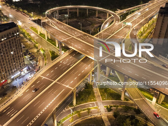 Vehicles run on a viaduct in the urban district of Huai'an City, China, on September 5, 2024. (