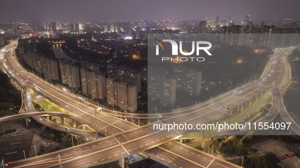 Vehicles run on a viaduct in the urban district of Huai'an City, China, on September 5, 2024. 