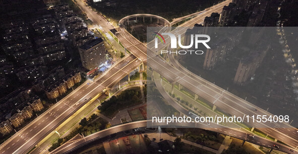 Vehicles run on a viaduct in the urban district of Huai'an City, China, on September 5, 2024. 