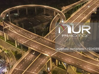 Vehicles run on a viaduct in the urban district of Huai'an City, China, on September 5, 2024. (