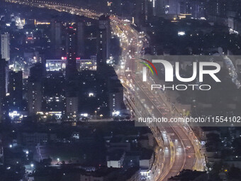 Vehicles run on a viaduct in the urban district of Huai'an City, China, on September 5, 2024. (