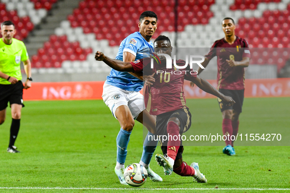 Jeremy Doku and Raz Shlomo are in action during Belgium vs Israel: matchday 1 of UEFA Nations League 2024-2025, at Nagyerdei Stadion in Debr...