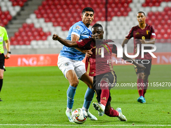 Jeremy Doku and Raz Shlomo are in action during Belgium vs Israel: matchday 1 of UEFA Nations League 2024-2025, at Nagyerdei Stadion in Debr...