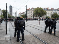 Protestors face the police during a protest after the appointment of a right-wing prime minister two days ago following July snap elections,...