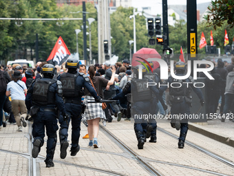 Police charge protestors during a protest after the appointment of a right-wing prime minister two days ago following July snap elections, i...