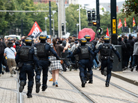 Police charge protestors during a protest after the appointment of a right-wing prime minister two days ago following July snap elections, i...