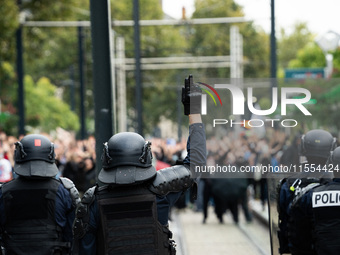 Protestors face the police during a protest after the appointment of a right-wing prime minister two days ago following July snap elections,...