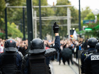 Protestors face the police during a protest after the appointment of a right-wing prime minister two days ago following July snap elections,...