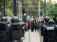 Protestors face the police during a protest after the appointment of a right-wing prime minister two days ago following July snap elections,...