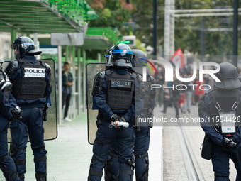 Protestors face the police during a protest after the appointment of a right-wing prime minister two days ago following July snap elections,...