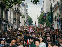 Thousands of protesters march during a protest after the appointment of a right-wing prime minister two days ago following July snap electio...