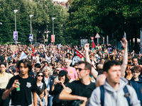 Thousands of protesters march during a protest after the appointment of a right-wing prime minister two days ago following July snap electio...