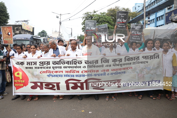 Medical students and doctors shout slogans during a protest rally towards Raj Bhavan, the official residence of the Governor of West Bengal...