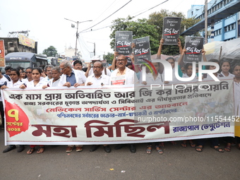 Medical students and doctors shout slogans during a protest rally towards Raj Bhavan, the official residence of the Governor of West Bengal...