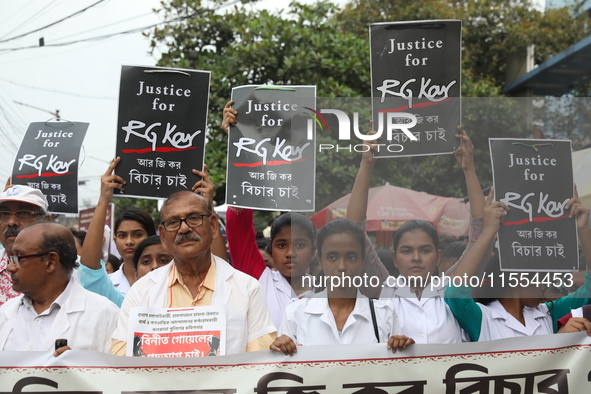 Medical students and doctors shout slogans during a protest rally towards Raj Bhavan, the official residence of the Governor of West Bengal...