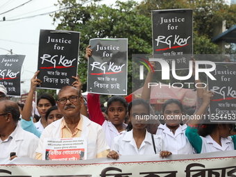 Medical students and doctors shout slogans during a protest rally towards Raj Bhavan, the official residence of the Governor of West Bengal...