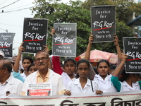 Medical students and doctors shout slogans during a protest rally towards Raj Bhavan, the official residence of the Governor of West Bengal...