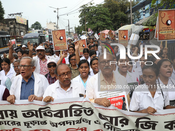 Medical students and doctors shout slogans during a protest rally towards Raj Bhavan, the official residence of the Governor of West Bengal...