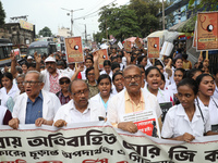 Medical students and doctors shout slogans during a protest rally towards Raj Bhavan, the official residence of the Governor of West Bengal...