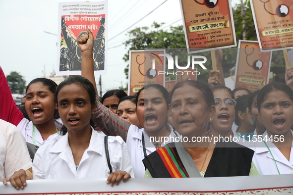 Medical students and doctors shout slogans during a protest rally towards Raj Bhavan, the official residence of the Governor of West Bengal...