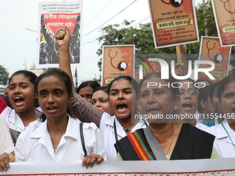 Medical students and doctors shout slogans during a protest rally towards Raj Bhavan, the official residence of the Governor of West Bengal...