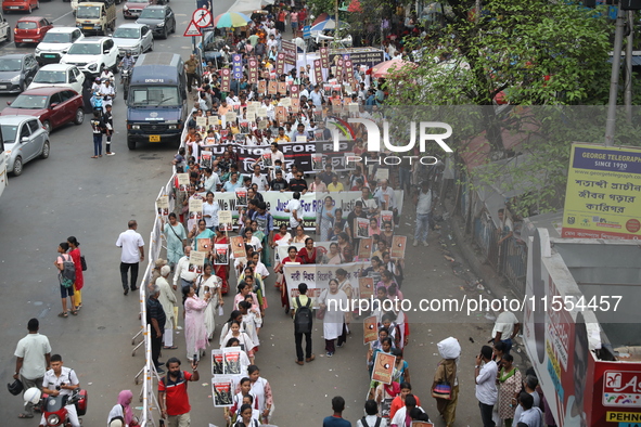 Medical students and doctors shout slogans during a protest rally towards Raj Bhavan, the official residence of the Governor of West Bengal...